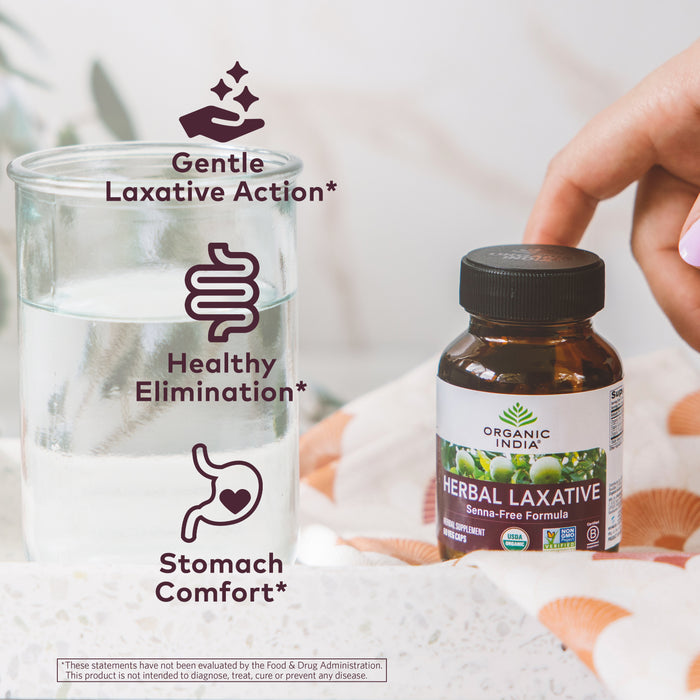 Organic, senna-free Herbal laxative capsules in glass jar for gentle laxative, healthy elimination, and stomach comfort.