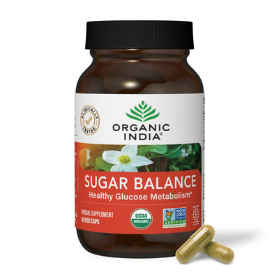 Organic sugar balance supplement, herbal glucose metabolism capsules in glass jar.