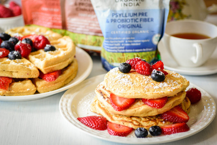 pancakes with strawberry and blueberry on a plate