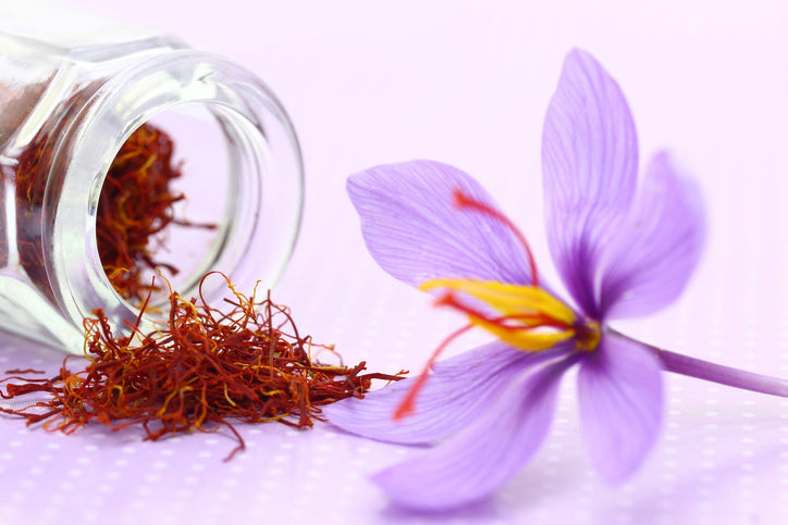 saffron flower and spice on a pink tablecloth