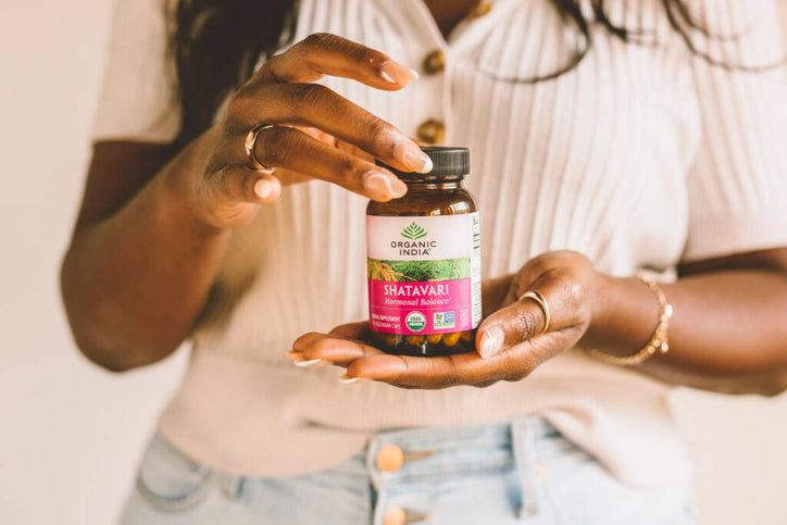 woman holding organic shatavari capsules