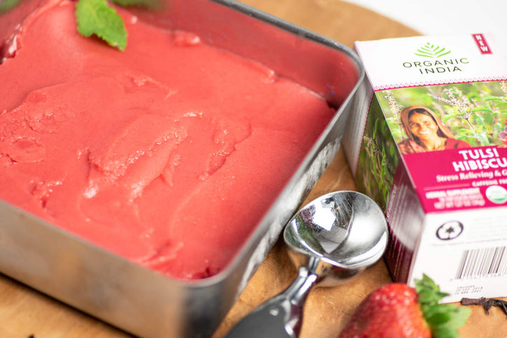 strawberry hibiscus sorbet in metal tray with scooper