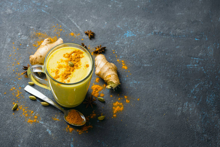 tumeric milk with ginger on the side